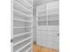 Bright, organized walk-in closet with built-in shelves and drawers for ample storage at 11260 7Th E St, Treasure Island, FL 33706