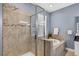 The elegant bathroom features a separate shower and a luxurious soaking tub for ultimate relaxation at 11325 78Th E St, Parrish, FL 34219