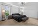 A calming bedroom with natural light, a ceiling fan, and dark furniture provides a serene personal retreat at 11325 78Th E St, Parrish, FL 34219