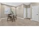 Dining room with modern light fixture, neutral paint and tile flooring at 11325 78Th E St, Parrish, FL 34219