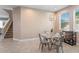 Dining room with a modern table, decor light and staircase in the background at 11325 78Th E St, Parrish, FL 34219