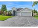 Charming home with a large driveway and a well-manicured lawn at 11325 78Th E St, Parrish, FL 34219