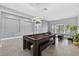 Large game room with a pool table, tile floors, and plenty of natural light at 11325 78Th E St, Parrish, FL 34219