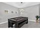 Game room with a pool table and modern light fixture at 11325 78Th E St, Parrish, FL 34219
