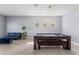 Bright game room featuring a pool table, modern light fixture, and tile flooring at 11325 78Th E St, Parrish, FL 34219