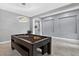 Bright game room with pool table, modern lighting, and tile floors at 11325 78Th E St, Parrish, FL 34219