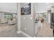 Hallway view showcasing the living room and kitchen with modern finishes and neutral color scheme at 11325 78Th E St, Parrish, FL 34219
