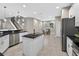 Kitchen featuring an island, modern appliances, a dining area and stairs at 11325 78Th E St, Parrish, FL 34219