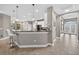 Open kitchen and hallway entrance with bar seating and modern finishes and recessed lights at 11325 78Th E St, Parrish, FL 34219