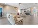 A spacious living room boasts a modern kitchen and an open floor plan, creating a welcoming and airy atmosphere at 11325 78Th E St, Parrish, FL 34219