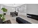 Open concept living room with a pool table, modern light fixture, and tile flooring at 11325 78Th E St, Parrish, FL 34219