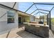 Relax on the screened-in patio with an outdoor kitchen and hot tub at 11325 78Th E St, Parrish, FL 34219