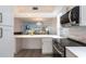 Modern kitchen with peninsula open to the dining room and living room at 1150 Tarpon Center Dr # 1D, Venice, FL 34285