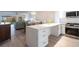 Modern kitchen with stainless steel appliances and white cabinetry at 1150 Tarpon Center Dr # 1D, Venice, FL 34285