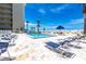 Enjoy this beautiful beachfront pool with lounge chairs, umbrellas and tropical landscaping at 1150 Tarpon Center Dr # 1D, Venice, FL 34285