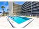 Great building pool with ocean views and lounge chairs for residents or guests at 1150 Tarpon Center Dr # 1D, Venice, FL 34285