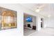 Bright sunroom featuring stained glass and access to the living room with a fireplace at 1150 Tarpon Center Dr # 1D, Venice, FL 34285