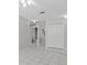 Bedroom closet with open door and tile flooring at 11835 Shrewsbury Ln, Parrish, FL 34219