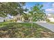 Lovely single-story home with a well-maintained lawn, lush landscaping, and an attached two-car garage at 11835 Shrewsbury Ln, Parrish, FL 34219