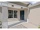 Welcoming front entrance featuring a decorative door, sidelight, and a covered porch area at 11835 Shrewsbury Ln, Parrish, FL 34219