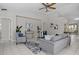 Stylish living room with modern furnishings, tile flooring, and plenty of natural light at 11835 Shrewsbury Ln, Parrish, FL 34219