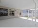 Covered patio with neutral color palette, offers a serene space for outdoor entertaining at 11835 Shrewsbury Ln, Parrish, FL 34219