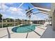 Screened-in pool area with a calming water view provides a private backyard retreat at 11835 Shrewsbury Ln, Parrish, FL 34219