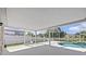 A lovely screened-in pool offers a relaxing outdoor oasis with picturesque water views at 11835 Shrewsbury Ln, Parrish, FL 34219
