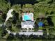 Aerial shot showcasing a community clubhouse, pool, playground, and ample parking at 11916 Castine St, New Port Richey, FL 34654