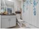 Bright bathroom featuring a combination shower and tub, stylish vanity, and modern fixtures at 11916 Castine St, New Port Richey, FL 34654