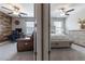 Split view of bedrooms reveals functional office space and a peaceful bedroom with cozy, neutral decor at 11916 Castine St, New Port Richey, FL 34654