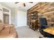 Functional room featuring a unique wood paneling, workstation, and comfortable seating at 11916 Castine St, New Port Richey, FL 34654