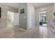 Inviting entryway with a half bath and access to the patio, offering a seamless indoor-outdoor transition at 11916 Castine St, New Port Richey, FL 34654