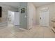 Welcoming entryway leads to a convenient half bathroom and features neutral tones and stylish decor at 11916 Castine St, New Port Richey, FL 34654