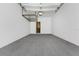 Clean, empty garage featuring ample storage space and a well-lit interior at 11916 Castine St, New Port Richey, FL 34654