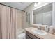 This bathroom features decor art, a tub, shower and vanity at 12025 Greengate Dr, Hudson, FL 34669