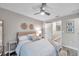 Comfortable bedroom featuring soft lighting, a cozy atmosphere and a mirror at 12025 Greengate Dr, Hudson, FL 34669