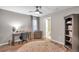 This bedroom features natural light, ceiling fan and adjoined bathroom at 12025 Greengate Dr, Hudson, FL 34669