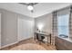 This bedroom features natural light, ceiling fan and a closet at 12025 Greengate Dr, Hudson, FL 34669