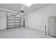 Spacious two car garage with durable epoxy flooring and automated door at 12025 Greengate Dr, Hudson, FL 34669
