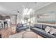 Comfortable living room with two sofas, hardwood floors, an area rug, and neutral walls at 12025 Greengate Dr, Hudson, FL 34669