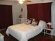 Serene bedroom with plush bedding, decorative pillows, and soft lighting at 12411 Brookside St, Spring Hill, FL 34609
