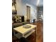 Bright living room boasting hardwood floors, comfortable seating, and decorative accents at 12411 Brookside St, Spring Hill, FL 34609