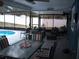 Inviting pool patio with dining area, comfortable seating, and stylish decor for outdoor enjoyment at 12411 Brookside St, Spring Hill, FL 34609