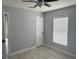 This spacious bedroom features a tile floor, modern ceiling fan, and a window that brings in natural light at 1309 29Th S St, St Petersburg, FL 33712