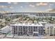 Aerial view showcases the condo's stunning waterfront location, complete with balconies and water views at 14300 Gulf Blvd # 104, Madeira Beach, FL 33708