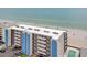 A beachfront condo building with balconies overlooking sandy beach and ocean views at 14300 Gulf Blvd # 104, Madeira Beach, FL 33708