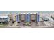 This is an aerial view of a multi-story building with parking and pool, conveniently located near the beach at 14300 Gulf Blvd # 104, Madeira Beach, FL 33708