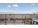 Balcony features an ocean view with a table and chairs at 14300 Gulf Blvd # 104, Madeira Beach, FL 33708