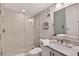 Bathroom features a walk-in shower, marble vanity, and updated fixtures at 14300 Gulf Blvd # 104, Madeira Beach, FL 33708